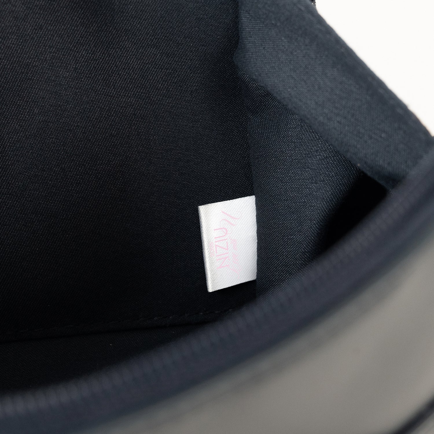 POUCH / NiziU『Live with U 2025 “NEW EMOTION : Face To Face